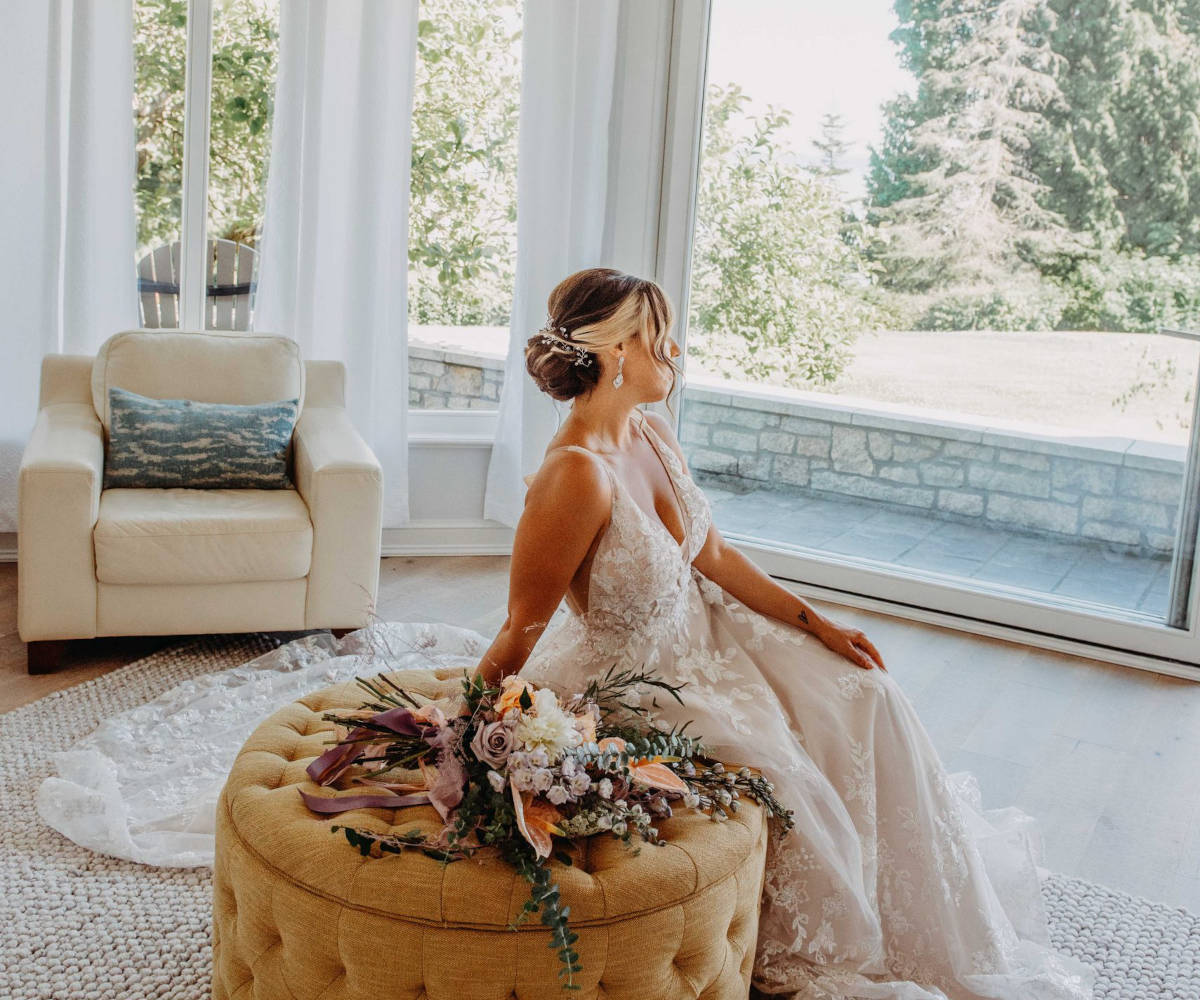 Bride sits in the Bedroom of the Villa.