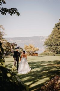 Bride and Groom walking through the yard.